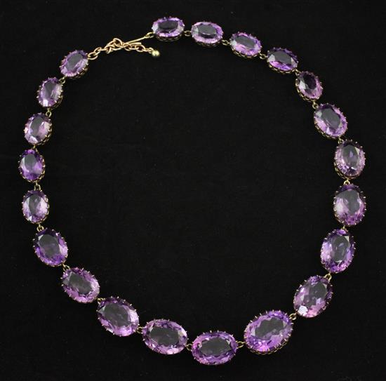 A gold and amethyst necklace, 16in.